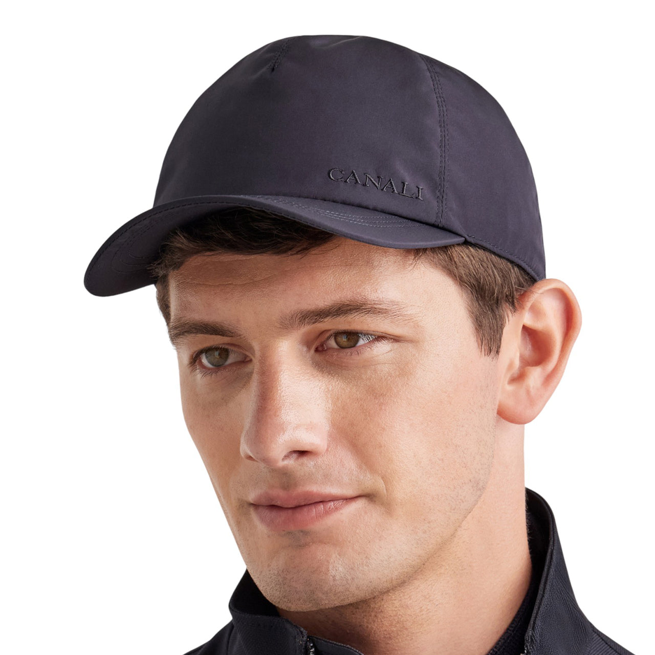 Blue baseball cap with embroidered logo and adjustable leather closure