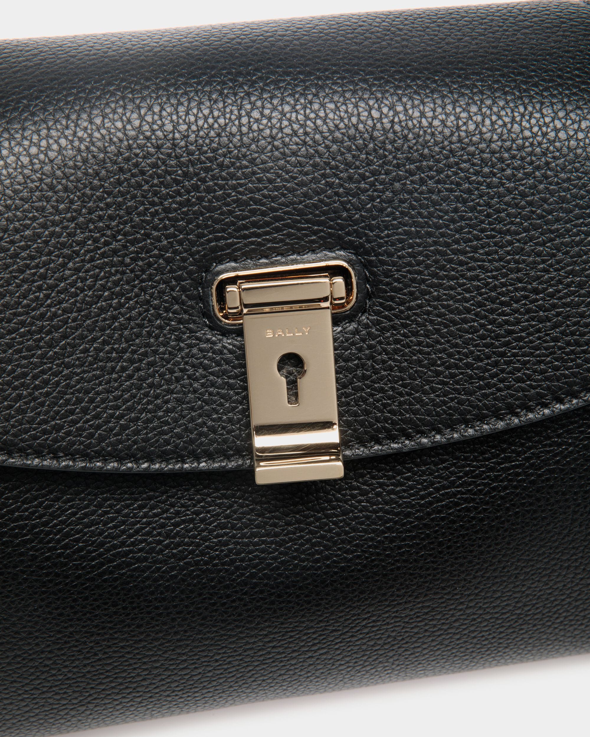 Lock Me Small Top Handle Bag In Black And Brown Grained Leather